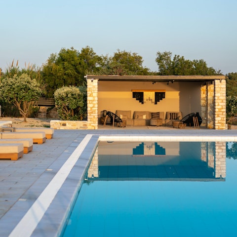 Enjoy views of the Aegean Sea from the shared pool