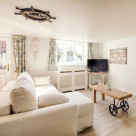 Settle in with a cup of tea in the cosy living area – we love the handmade coffee table