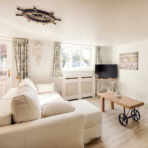 Settle in with a cup of tea in the cosy living area – we love the handmade coffee table