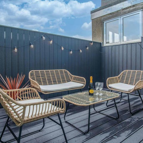 Have a glass of Welsh whisky on the light-festooned terrace