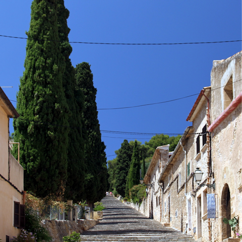 Take the short drive to explore the historic old town of Pollença