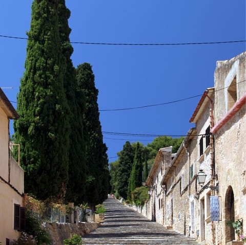Take the short drive to explore the historic old town of Pollença