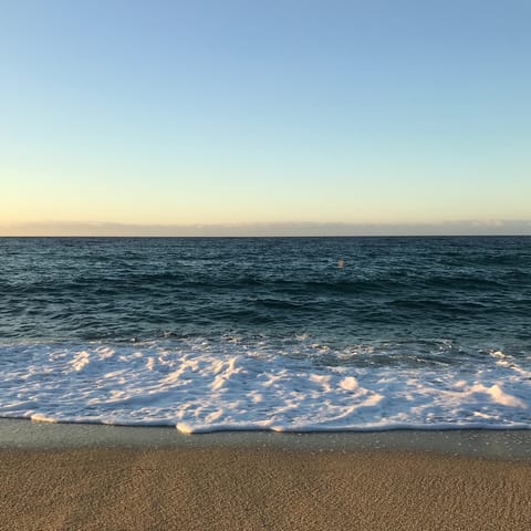 Snorkel in the Ionian Sea or relax on Perigiali Beach, a short drive away