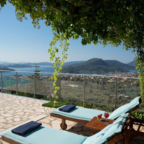 Sip something chilled as you kick back on a comfy lounger