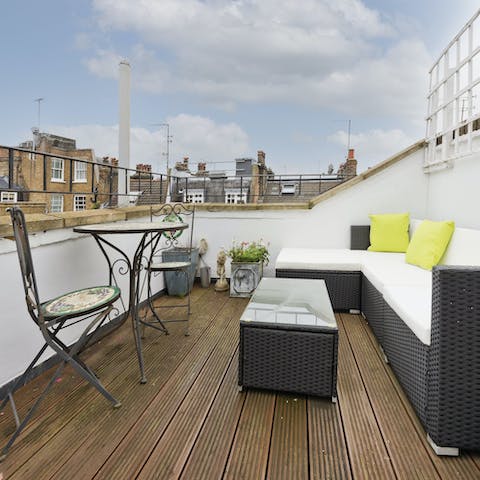 Enjoy glasses of G&T on the roof terrace