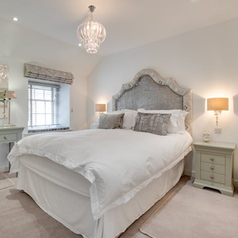 Sink into a luxurious king-size bed after a busy day exploring