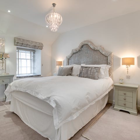 Sink into a luxurious king-size bed after a busy day exploring