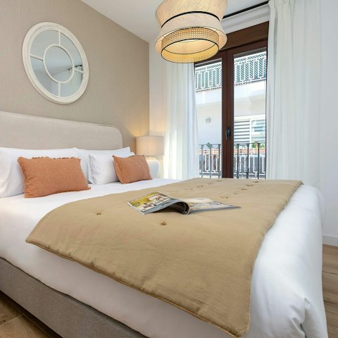 Wake up to city views from the bedroom balcony
