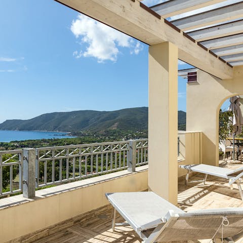 Sit back and relax on the balcony while taking in sweeping sea views
