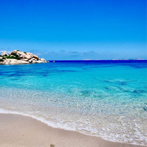 Take a short stroll down to Torre delle Stelle's sandy beach