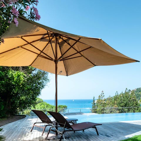Relax by the pool admiring the breathtaking sea views