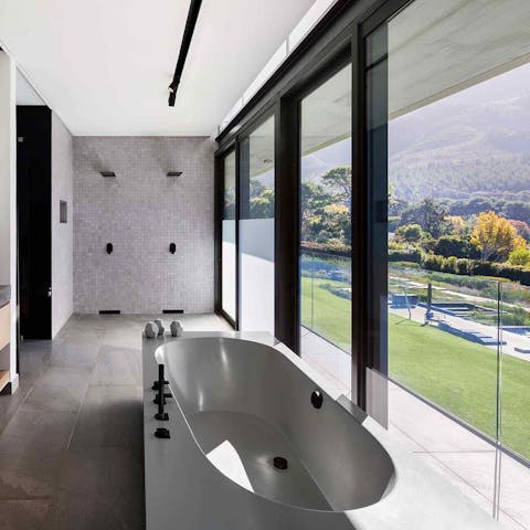 Watch the sun set whilst soaking the luxurious bath