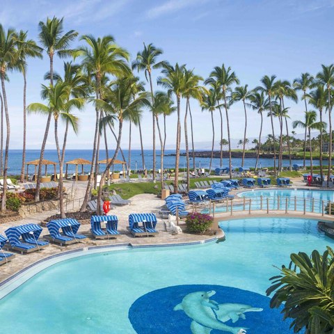 Soak up the sun while lounging by one of the resort pools