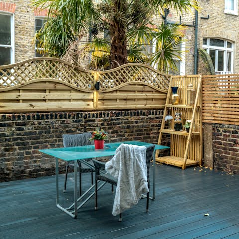 Unwind on the patio with cocktails after busy days in the city