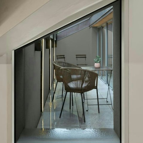 Sit back with a drink on the private balcony