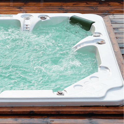 Soak in the outdoor hot tub