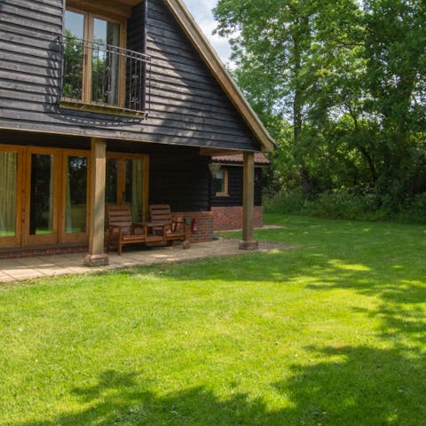Take your morning coffee outside and catch up on your book on the garden chairs