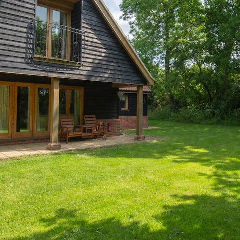 Take your morning coffee outside and catch up on your book on the garden chairs