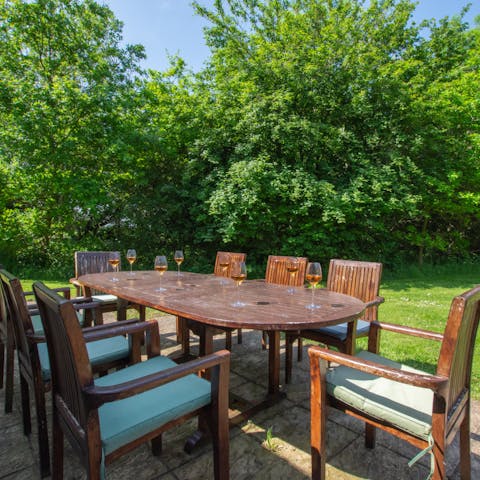 Gather around the outdoor table for drinks and catch ups in the afternoon sunshine