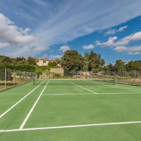 Spend sunny days with games of tennis on the private court