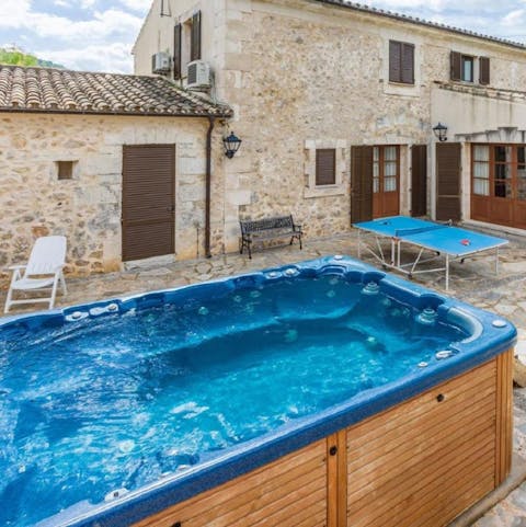 Soak sore muscles in the hot tub after a hike in the Tramuntana mountains