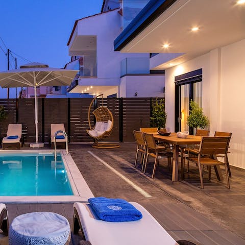 Serve up cocktails on the terrace after an evening swim