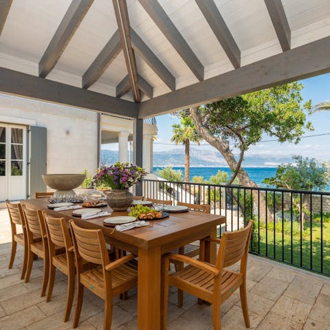 Dine on fresh seafood in the shade of the pergola