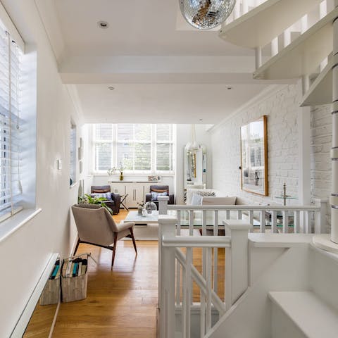 Relax in the bright living space with skylights and double height ceilings