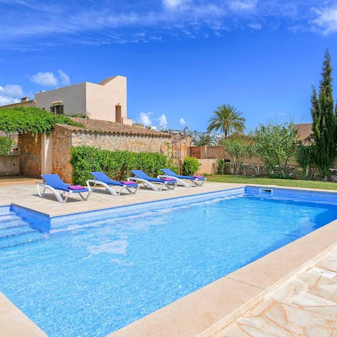 Enjoy lazy days relaxing by the swimming pool