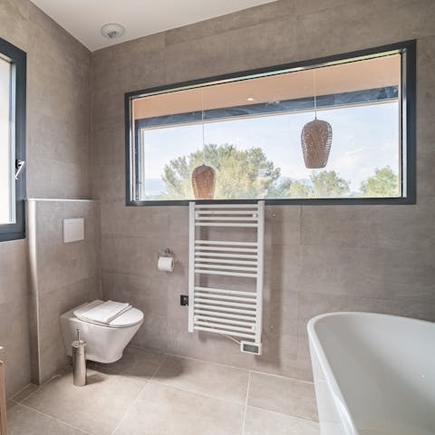 Run yourself a relaxing bubble bath in the freestanding tub
