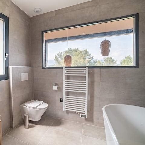 Run yourself a relaxing bubble bath in the freestanding tub