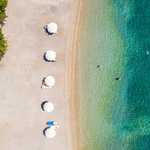 Discover the quiet sandy stretch of Polis Beach at the end of the private path from your villa