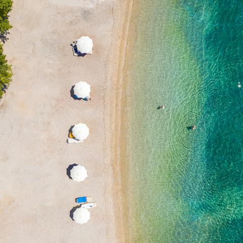 Discover the quiet sandy stretch of Polis Beach at the end of the private path from your villa