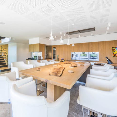 Gather everyone round the impressive dining table