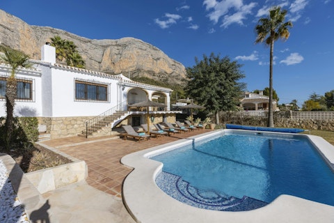 Swim with the Montgo mountain rising directly behind the villa