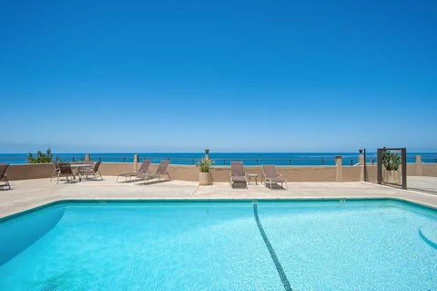 Swim laps in the communal pool with the Pacific horizon stretching ahead