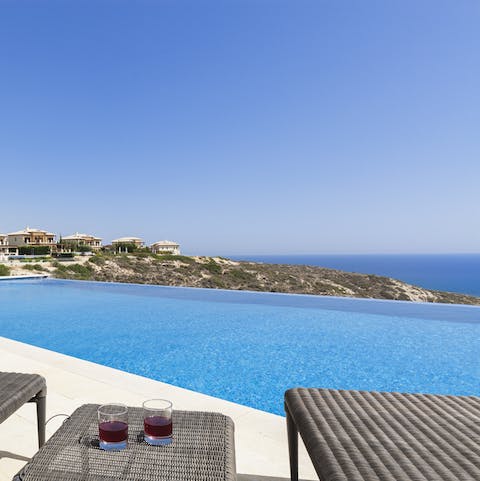 Admire the views from the hot tub and infinity pool combination