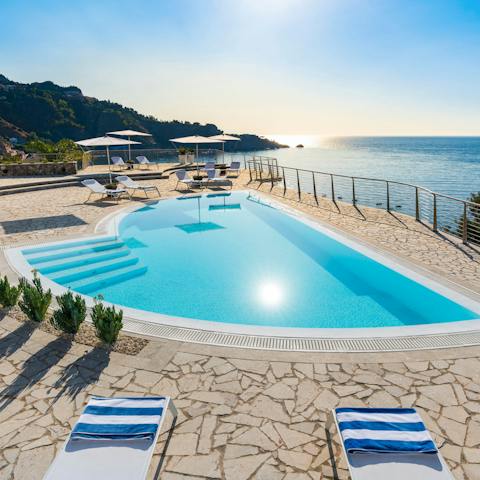 Splash about in the saltwater swimming pool and dry off on one of the loungers
