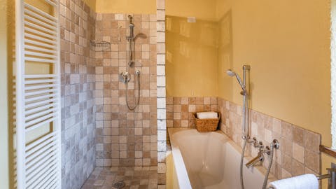 Treat yourself to an uninterrupted soak in the smartly tiled bathroom