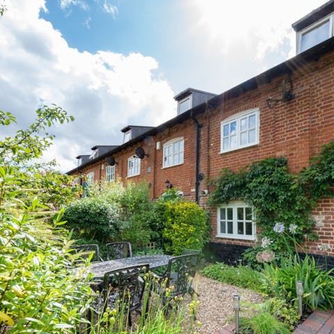 Enjoy a cup of tea with your furry friend at your feet in your gorgeous front garden