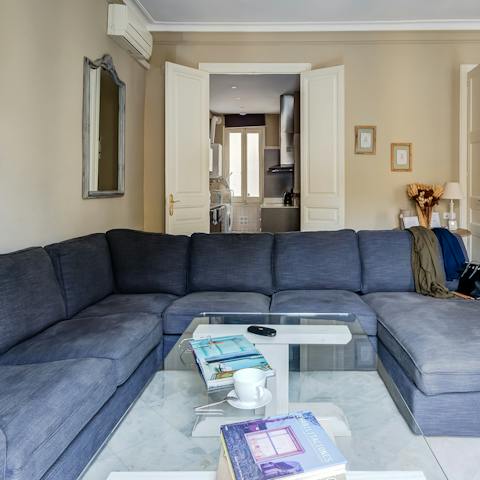 Curl up with a novel on the enormous sofa for a relaxing afternoon