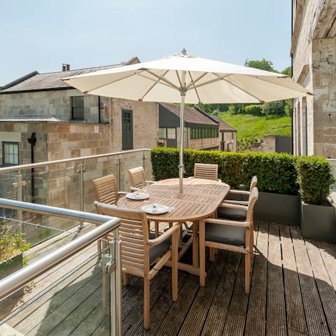 Dine alfresco on the sunny deck, admiring the rural views