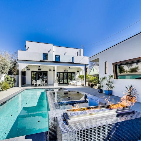 Spend summer afternoons switching between the swimming pool and hot tub