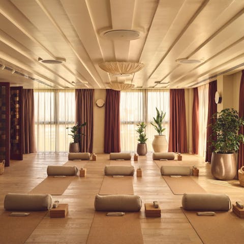 Relax and recharge in the peaceful yoga studio, perfect for all experience levels