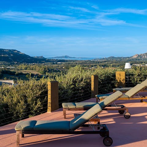 Lounge with a cocktail while admiring the far-reaching views