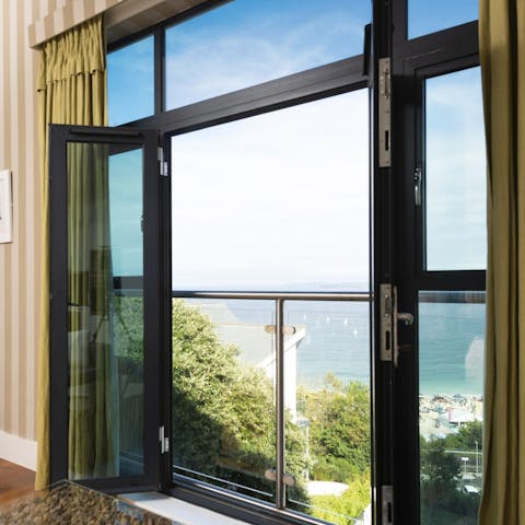 Throw open the sliding doors and watch the waves roll in from your Juliet balcony