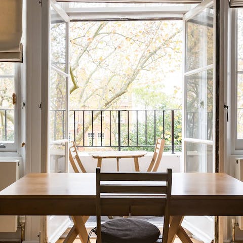 Sip a cup of coffee or a cocktail on the private balcony overlooking the gardens