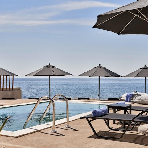 Spend relaxing days lounging at home by the pool