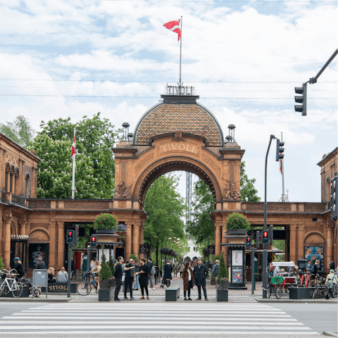 Take a twenty-minute walk to ride the rollercoasters at Tivoli Gardens