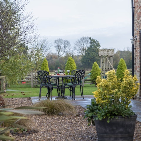Sip your complimentary tea out in the garden after feeding the chickens